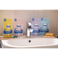 Tabs dental product packages on a sink with a tap and bar of soap