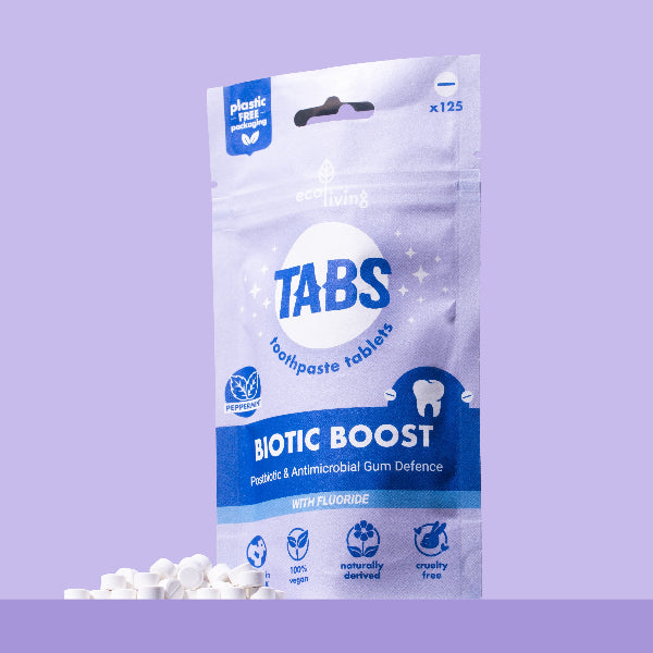 Package of Tabs toothpaste tablets with Biotic Boost with a purple background with tabs alongside