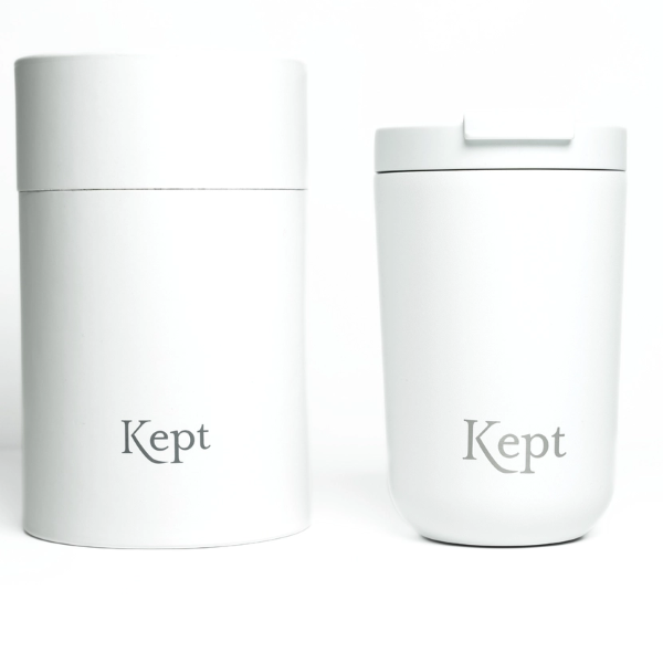 Vacuum travel mug in chalk colour (white) with Kept logo shown alongside cardboard gift box