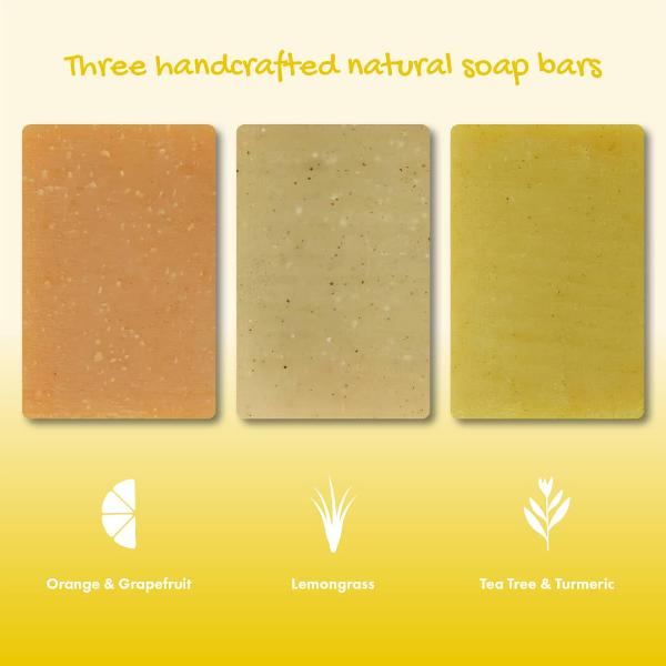 Three rectangular handcrafted natural soap bars displayed side by side on a yellow gradient background, labelled Orange & Grapefruit, Lemongrass, and Tea Tree & Turmeric.