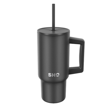 SHO reusable insulated large tumbler in jet black shown with straw