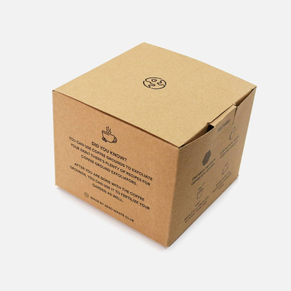 Brown cardboard box with reusable coffee filter with text and logo on a white background