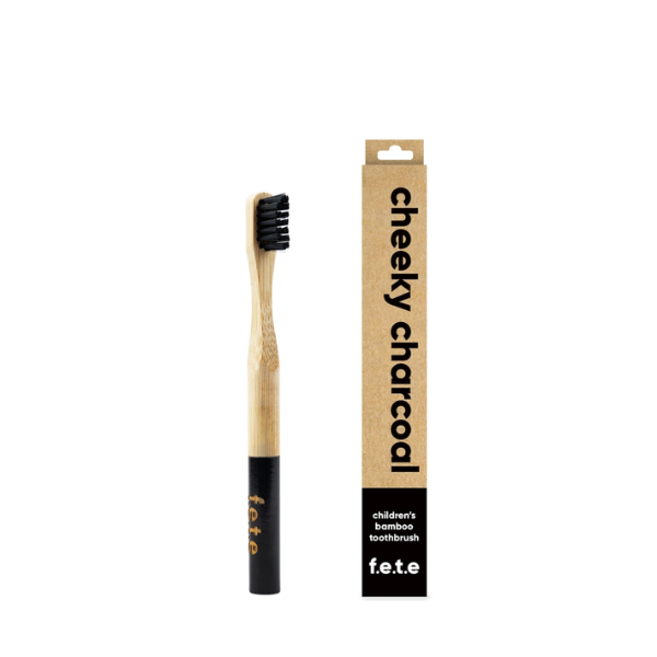 Child's bamboo toothbrush Cheeky charcoal (black bristles and tip of brush) shown alongside cardboard packaging