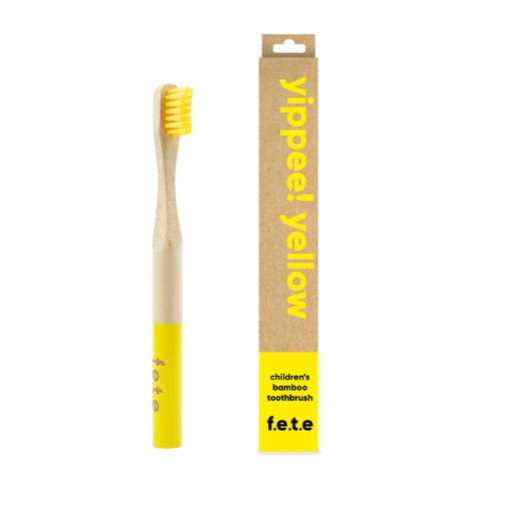 Child's bamboo toothbrush Yippee yellow (yellow bristles and tip of brush) shown alongside cardboard packaging