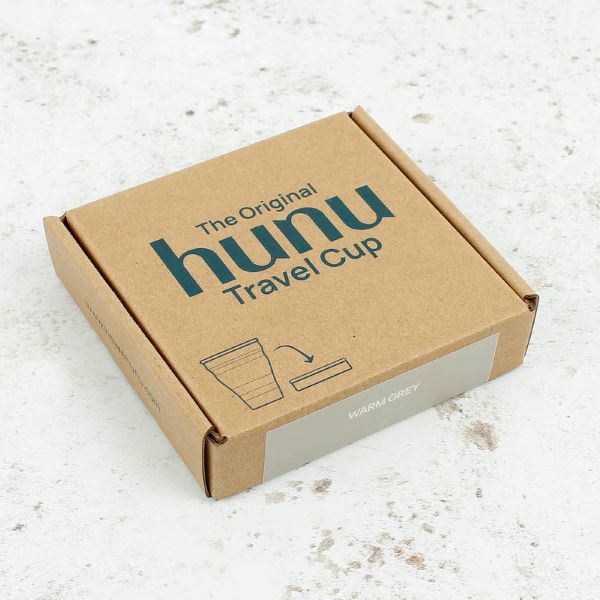 Collapsible cup shown in cardboard packaging