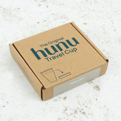 Collapsible cup shown in cardboard packaging