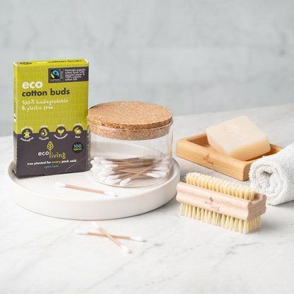 Organic cotton and paper cotton buds shown in cardboard packaging next to some buds in a jar