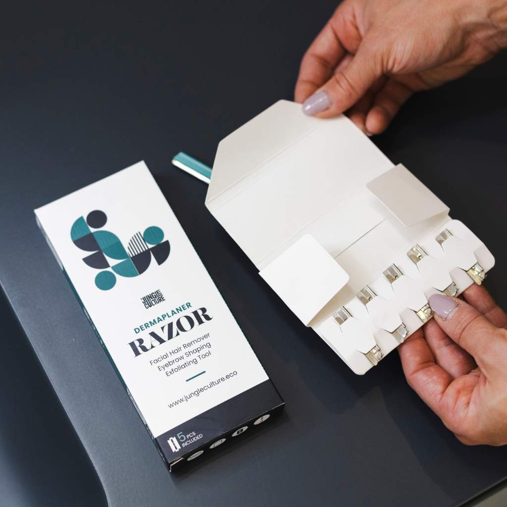 Jungle Culture's dermaplaner replacement razor blades in cardboard packaging
