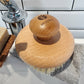 Wooden body brush with ecojiko logo on a bathroom counter next to soap