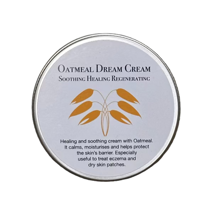 Oatmeal Dream Cream tin container with text on a white background and an image of oats
