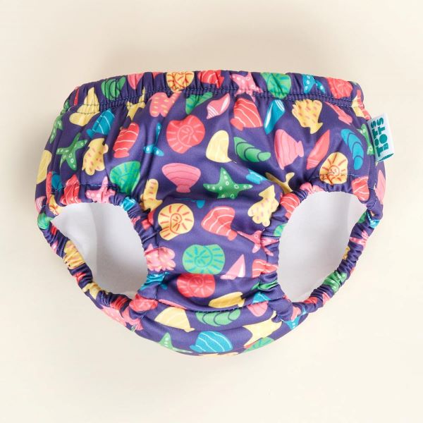 Reusable swim pants front view in Mussel Seashell design (navy blue background with colourful starfish, mussels and shells) 