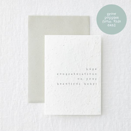 Eco-friendly seeded new baby card with logo saying 'grow poppies from this card'