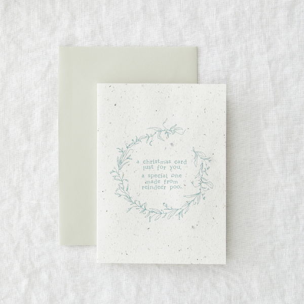 Christmas card saying 'A Christmas card just for you, a special one made from reindeer poo'