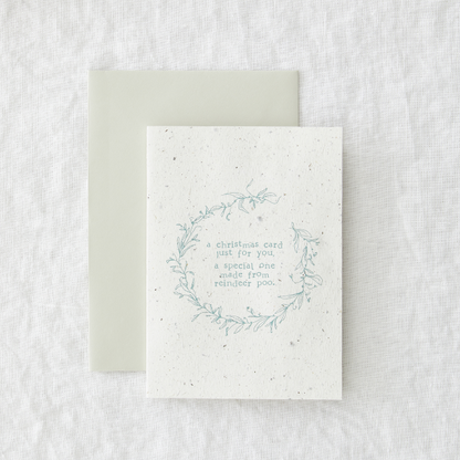 Christmas card saying 'A Christmas card just for you, a special one made from reindeer poo'