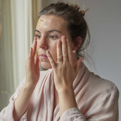 UpCircle cleansing balm being applied to face