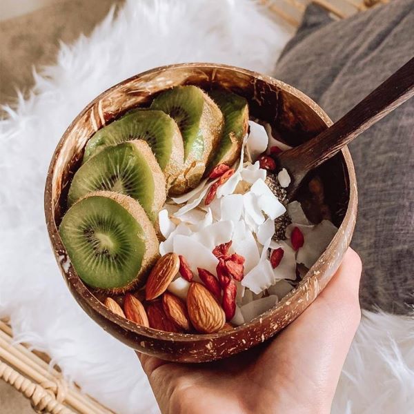 Coconut bowl and spoon set with fruit and nuts