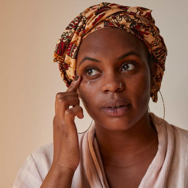 UpCircle eye cream being applied to the face