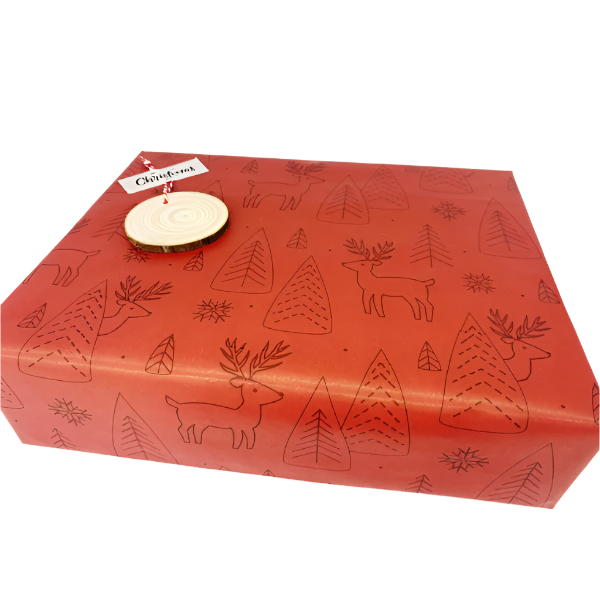 Eco-friendly Christmas wrapping paper Red with reindeer and trees in black outlines wrapping a parcel