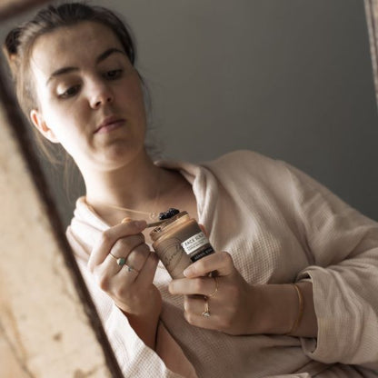 Girl holding coffee scrub pot