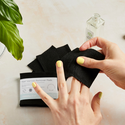 Reusable nail polish remover pads removing yellow varnish on fingernails