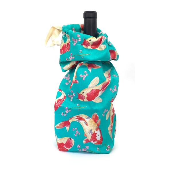 Reusable fabric bottle bag with bottle in fish design