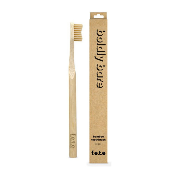 Bamboo toothbrush boldly bare (natural bristles and brush) shown alongside cardboard box
