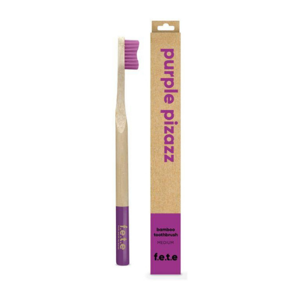 Bamboo toothbrush purple pizazz (purple bristles and tip of brush) shown alongside cardboard box